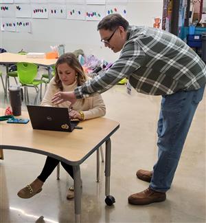 Tech Manager assisting Teacher
